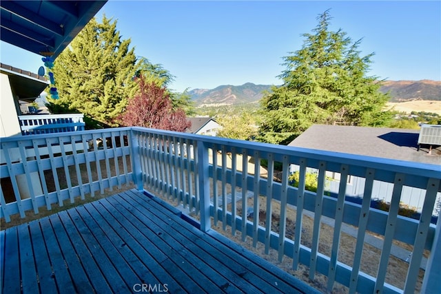 wooden deck featuring a mountain view