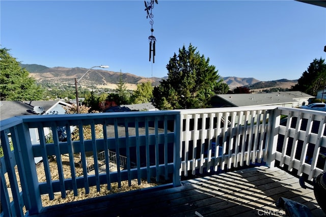 wooden terrace featuring a mountain view