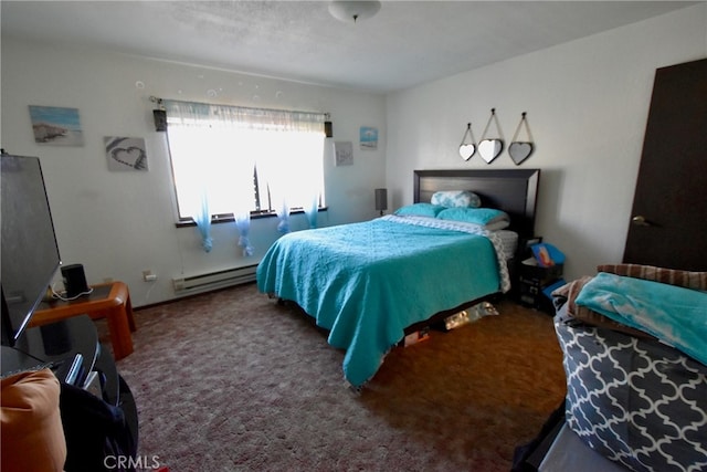 bedroom with carpet floors and a baseboard radiator