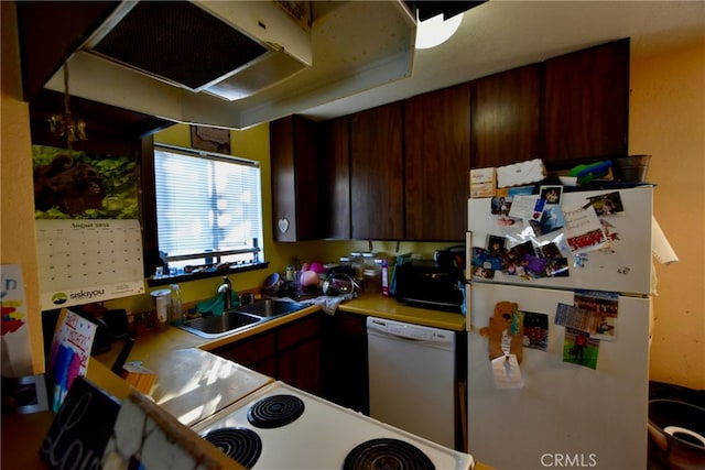 kitchen featuring white appliances and sink