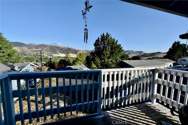 wooden terrace with a mountain view