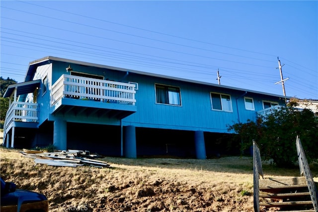 rear view of house with a wooden deck