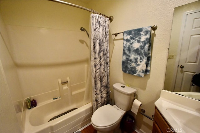 full bathroom featuring vanity, shower / bath combo with shower curtain, and toilet