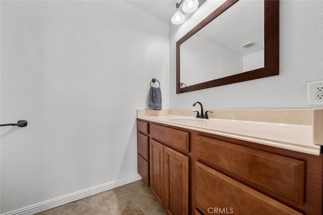 bathroom with tile patterned floors and vanity