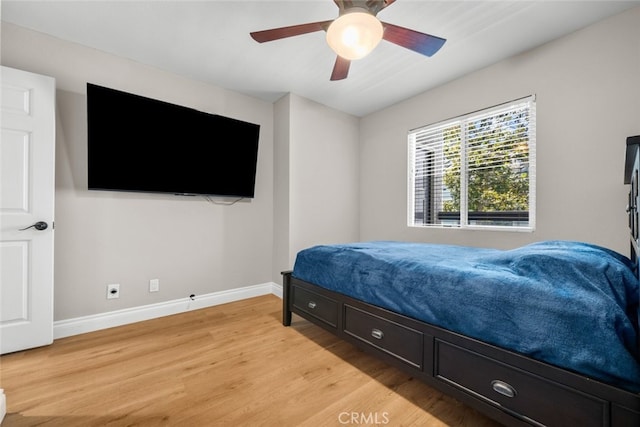 bedroom with ceiling fan and wood-type flooring