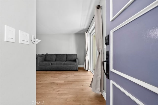 hall with light hardwood / wood-style floors