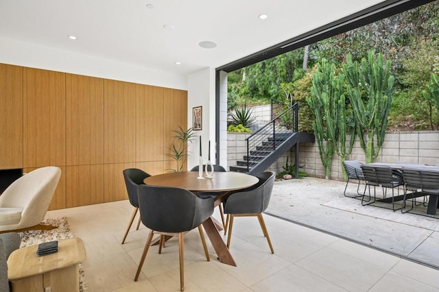 dining space with wooden walls