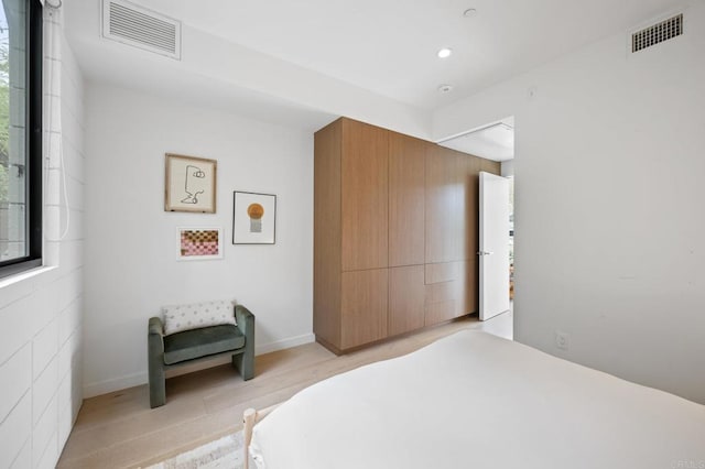 bedroom featuring light wood-type flooring