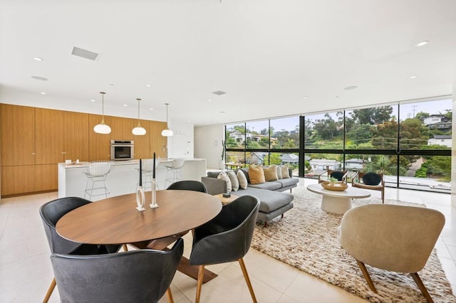 tiled dining space with expansive windows and wooden walls