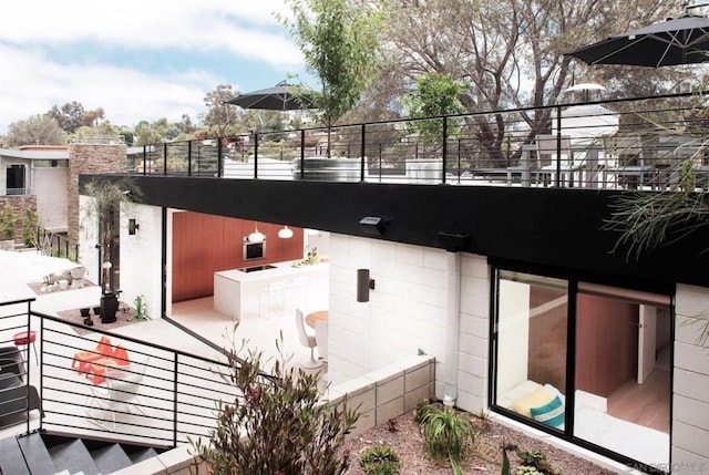 view of home's exterior featuring a balcony