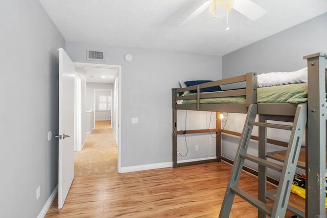 bedroom featuring ceiling fan and light wood-type flooring