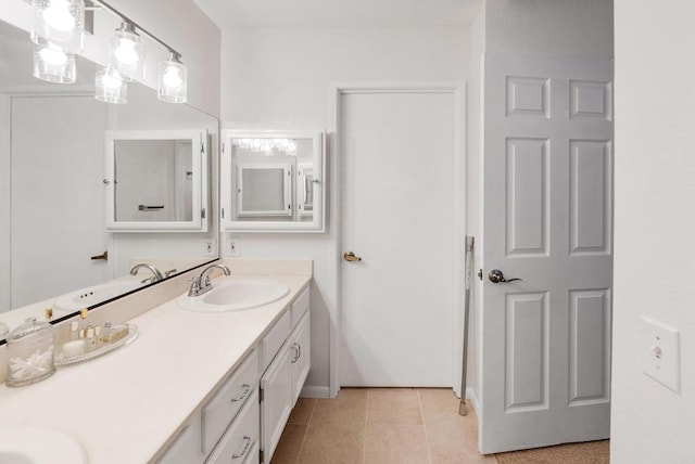 bathroom with tile patterned flooring and vanity