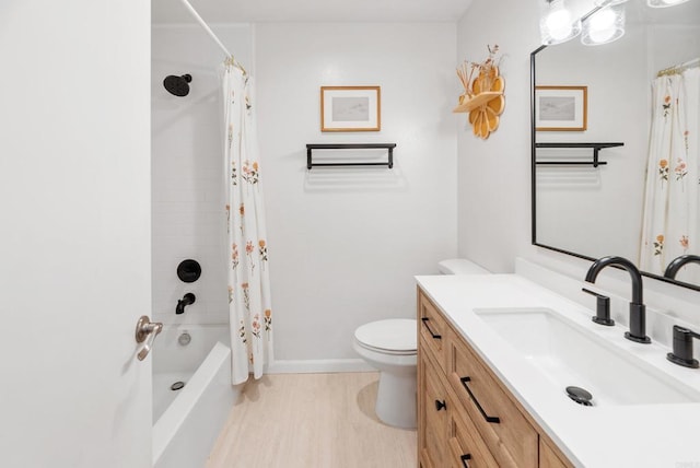 full bathroom with hardwood / wood-style floors, vanity, toilet, and shower / bath combo with shower curtain