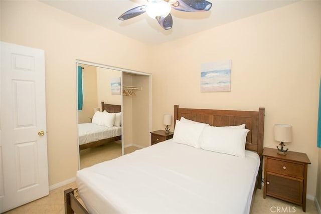 bedroom featuring ceiling fan and a closet