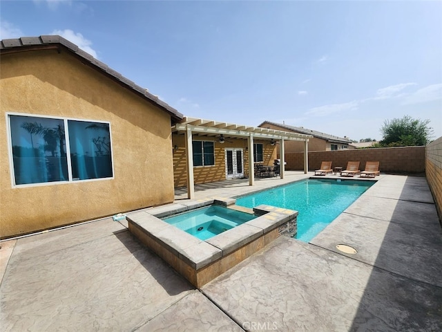 view of pool featuring a patio area and an in ground hot tub