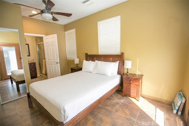 bedroom with multiple windows and ceiling fan