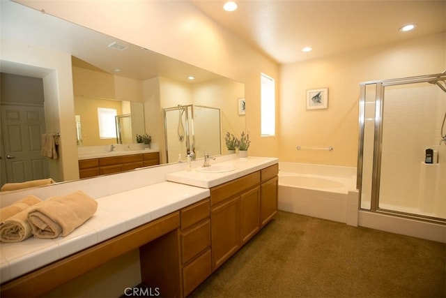 bathroom with independent shower and bath and vanity