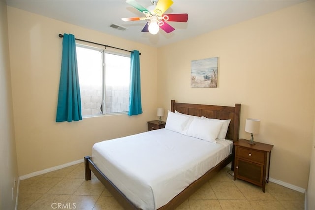 bedroom with light tile patterned flooring and ceiling fan