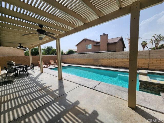 view of pool with a pergola, ceiling fan, and a patio