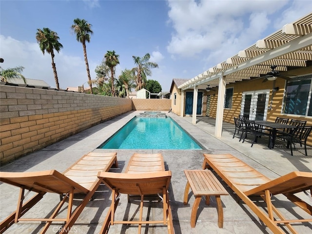 view of swimming pool featuring ceiling fan, a pergola, and a patio area