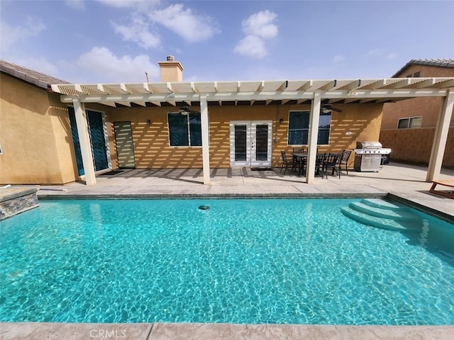 view of swimming pool featuring a patio, a pergola, grilling area, ceiling fan, and french doors