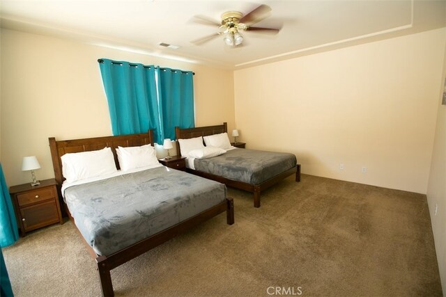 bedroom with light carpet and ceiling fan