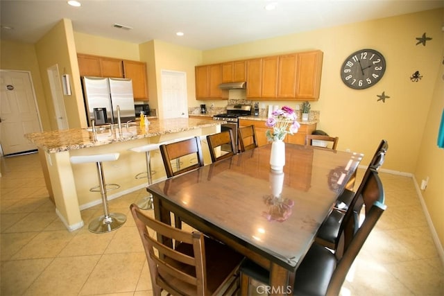 tiled dining area with sink