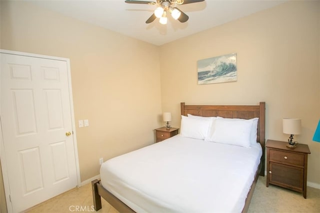 bedroom featuring light colored carpet and ceiling fan