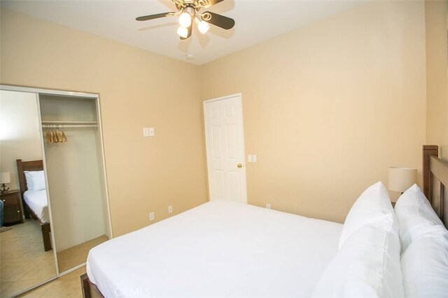 bedroom featuring ceiling fan and a closet