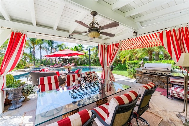 view of patio featuring area for grilling and ceiling fan