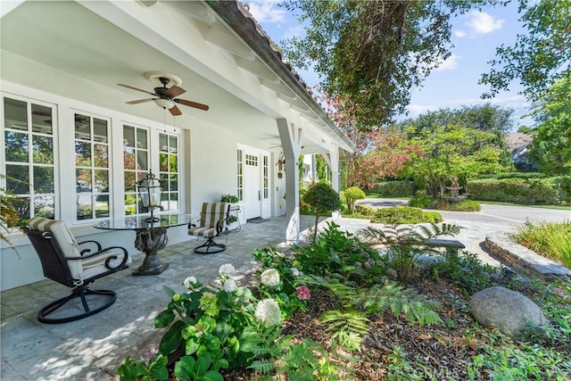 view of patio / terrace with ceiling fan and french doors