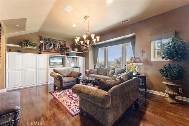 living room with a notable chandelier, vaulted ceiling, and dark wood-type flooring