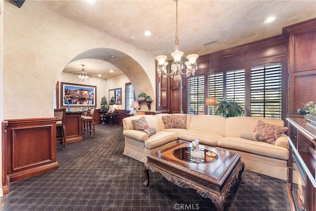 living room featuring a notable chandelier