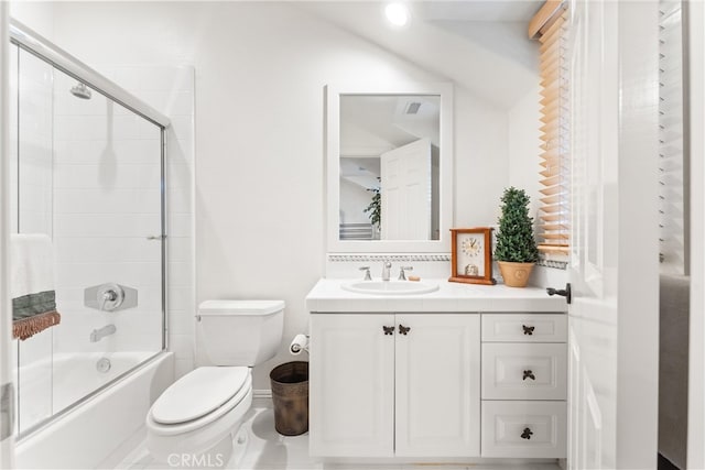 full bathroom with vanity, toilet, and combined bath / shower with glass door