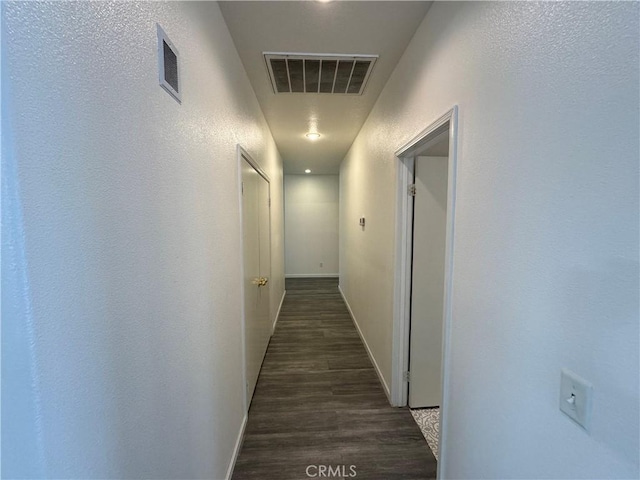 hall with dark hardwood / wood-style flooring