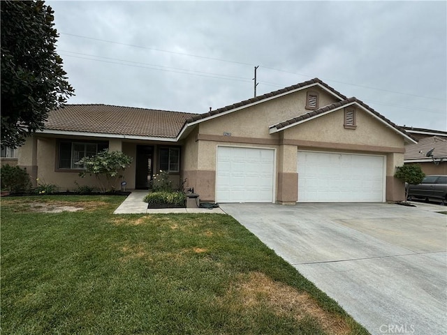 ranch-style home featuring a garage and a front lawn