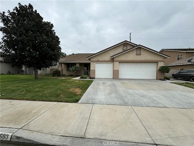 ranch-style house with a garage and a front yard