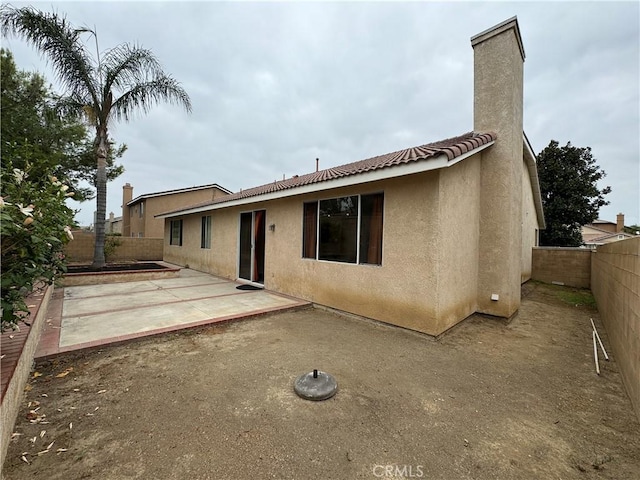 back of house featuring a patio area