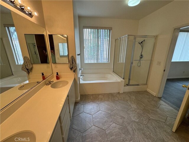 bathroom with vanity and plus walk in shower