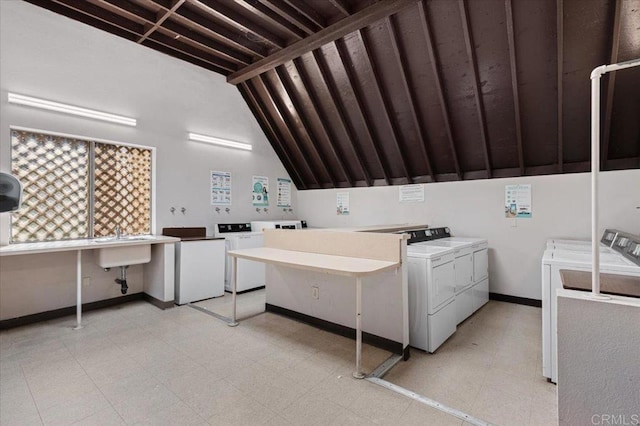 washroom featuring sink and independent washer and dryer