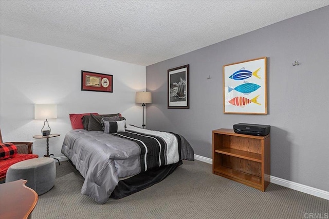 bedroom with carpet floors and a textured ceiling