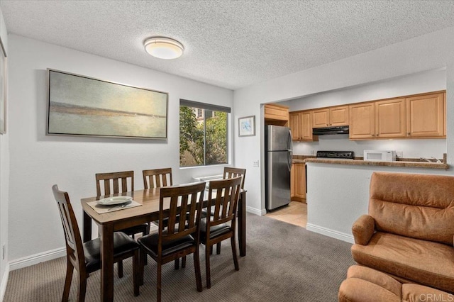 dining room with light colored carpet