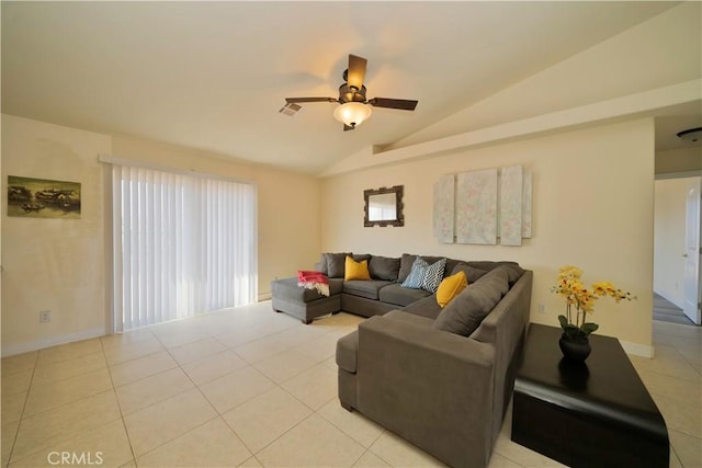 tiled living room featuring ceiling fan and vaulted ceiling