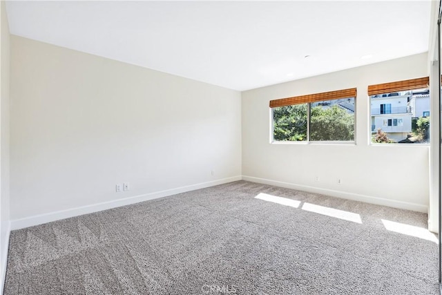 unfurnished room with carpet flooring