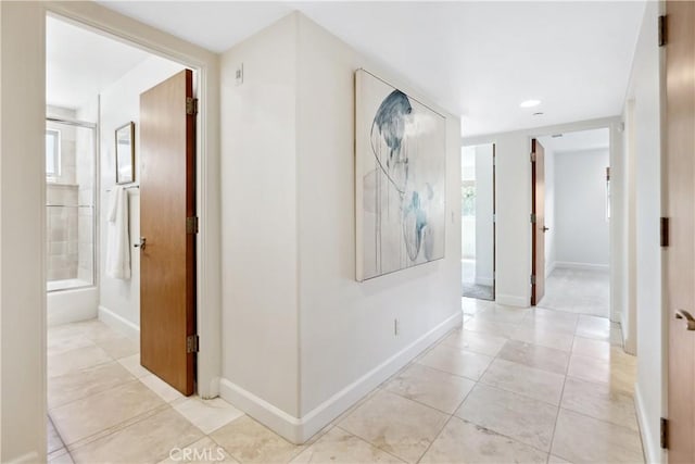 hallway featuring light tile patterned flooring