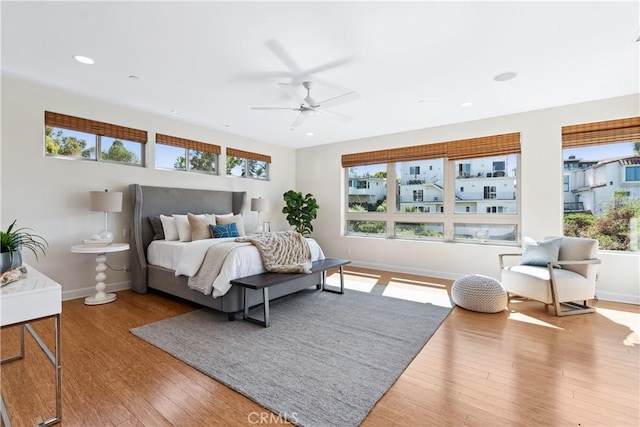 bedroom featuring hardwood / wood-style floors and ceiling fan