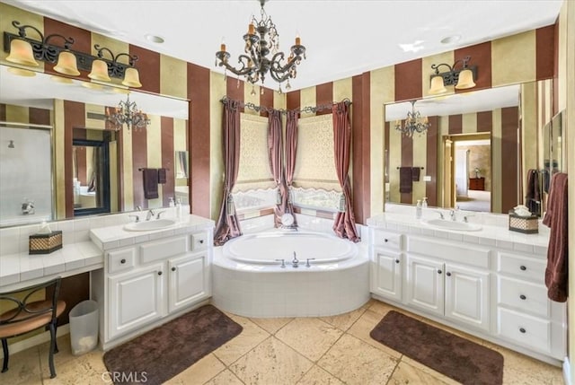 bathroom featuring separate shower and tub and vanity