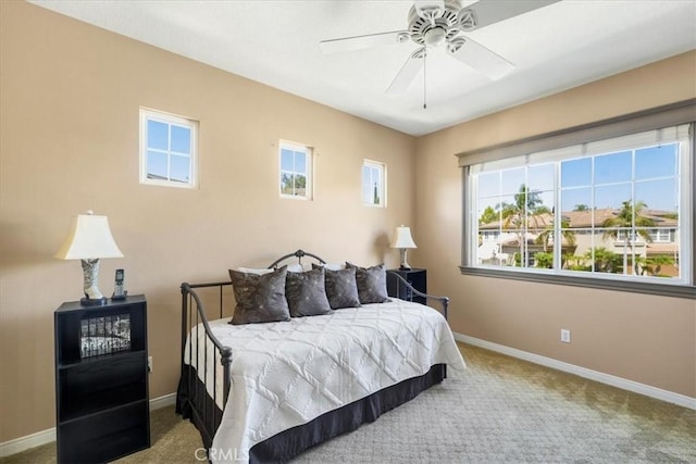 bedroom with ceiling fan and carpet floors