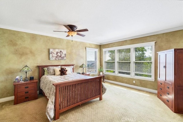 bedroom with ceiling fan, light colored carpet, and ornamental molding