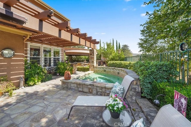 view of patio featuring an in ground hot tub and a pergola